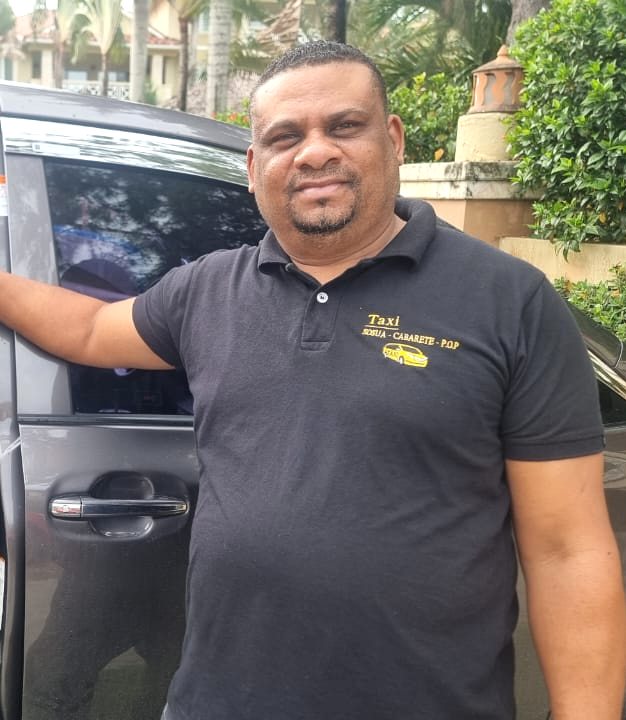 Winton, driver of My DR Taxi, with his Toyota minivan